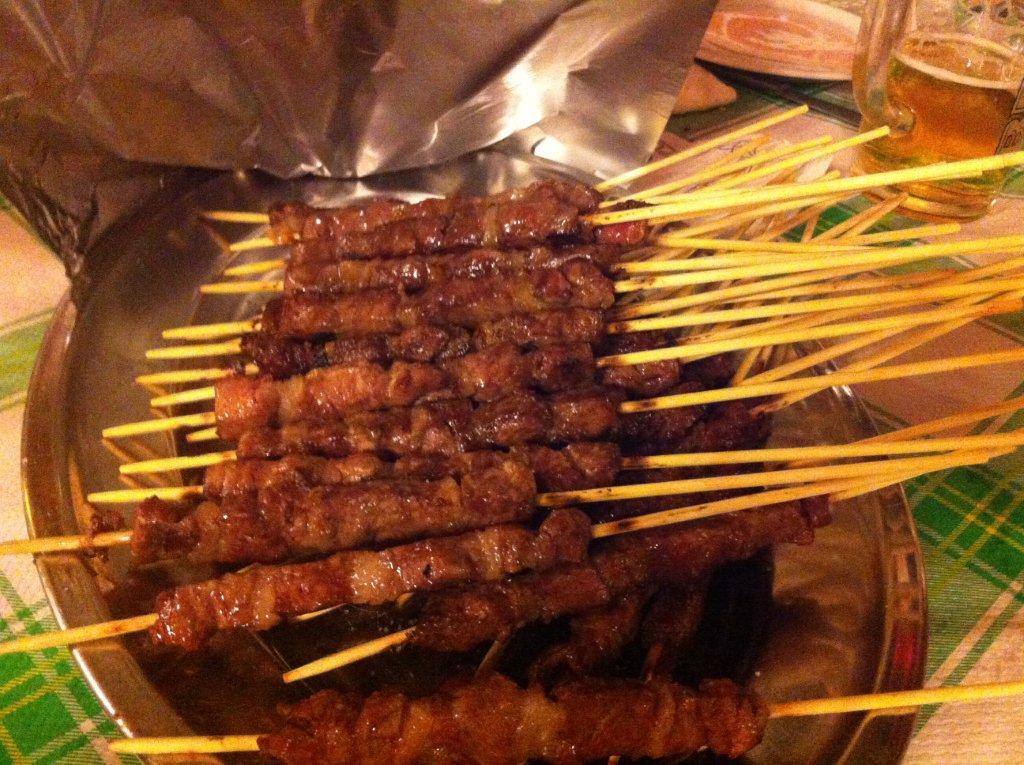 Try delicious arrosticini in Abruzzo - lamb skewers cooked on a flame