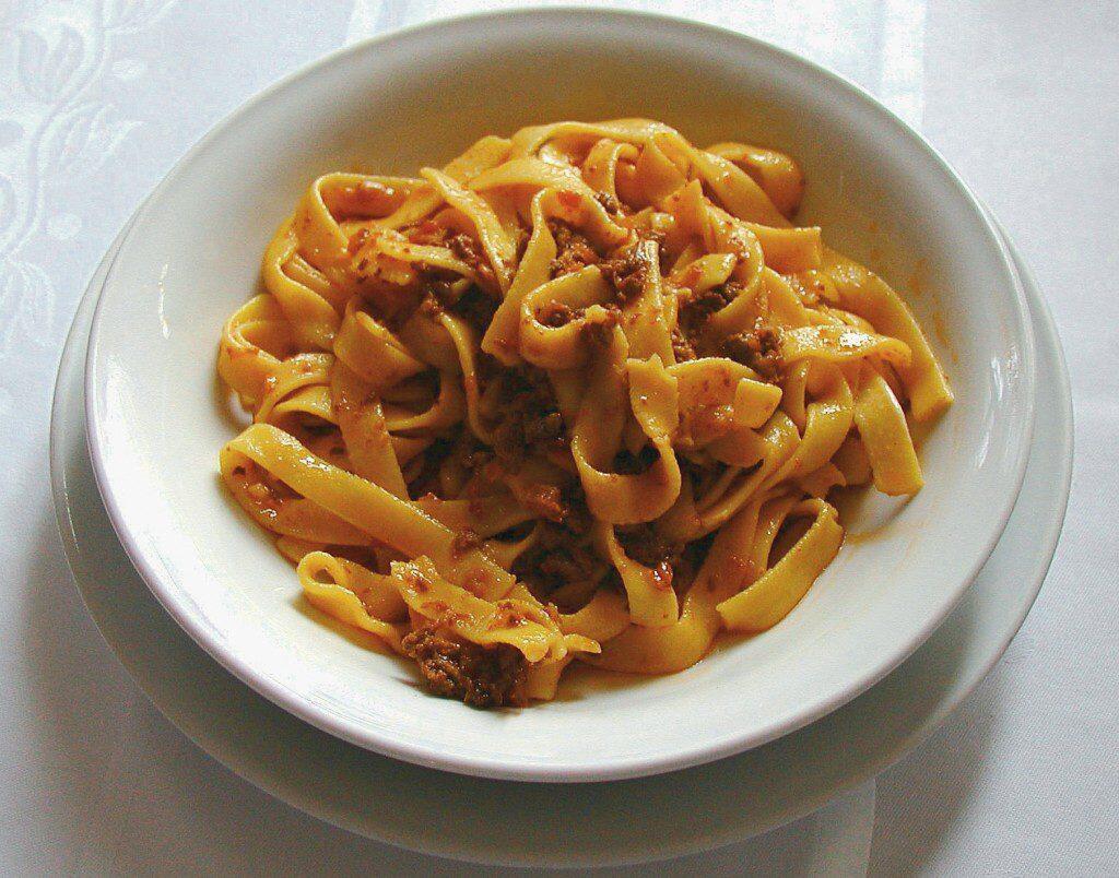 A hearty dish of fettucine con ragu.