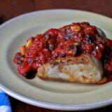 Swordfish with tomatoes, olives, pine nuts, and raisins