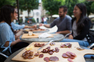 charcuterie board with people in the background