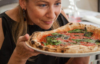 Woman in naples admiring her pizza