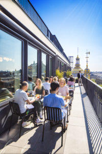 people sitting at printemps rooftop