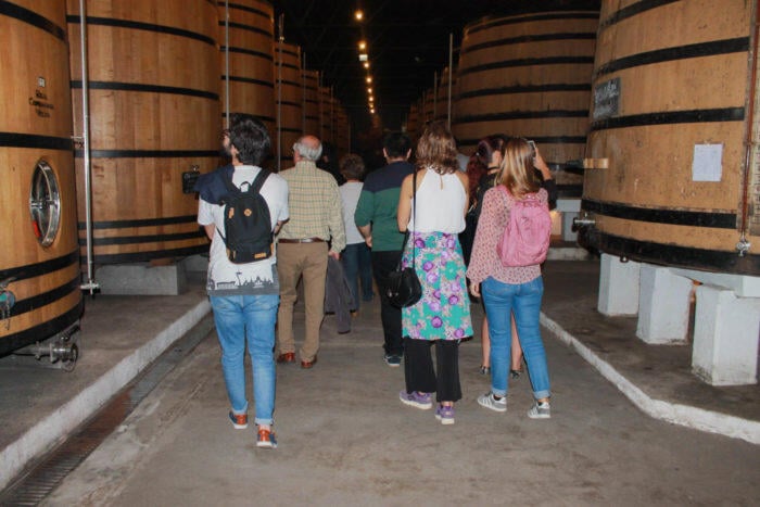 Group of people in a Porto wine cellar