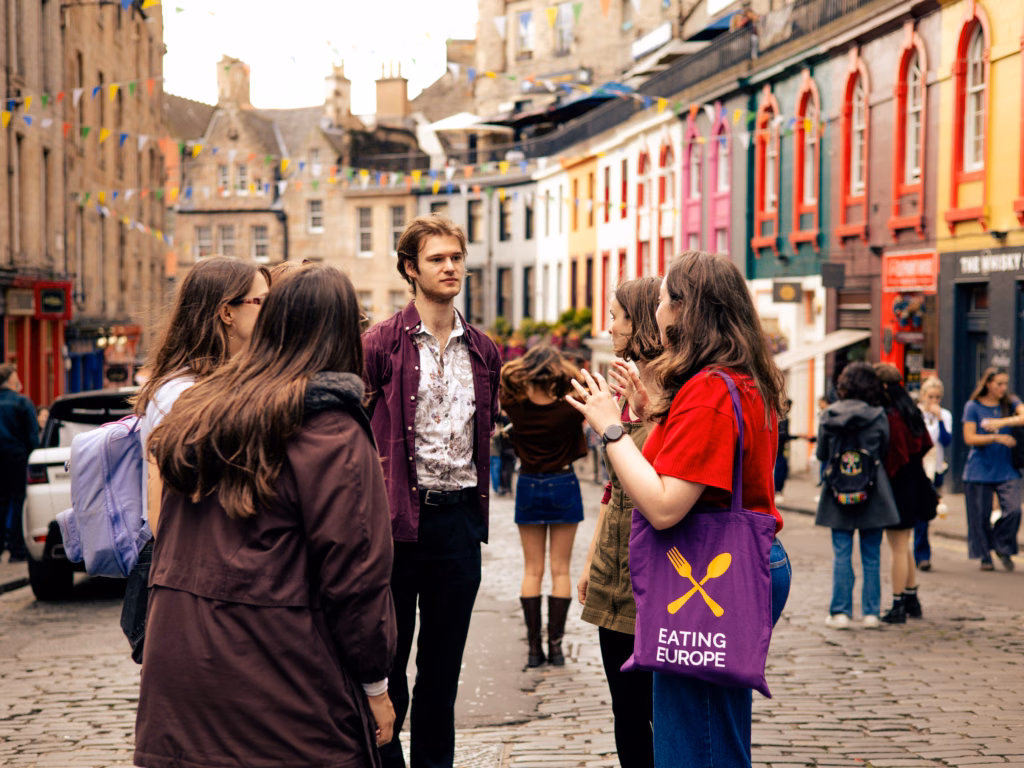 Our guide sharing a story with guests in a lively square