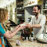 Woman_being_served_food_Trattoria_da_Ginone_Florence